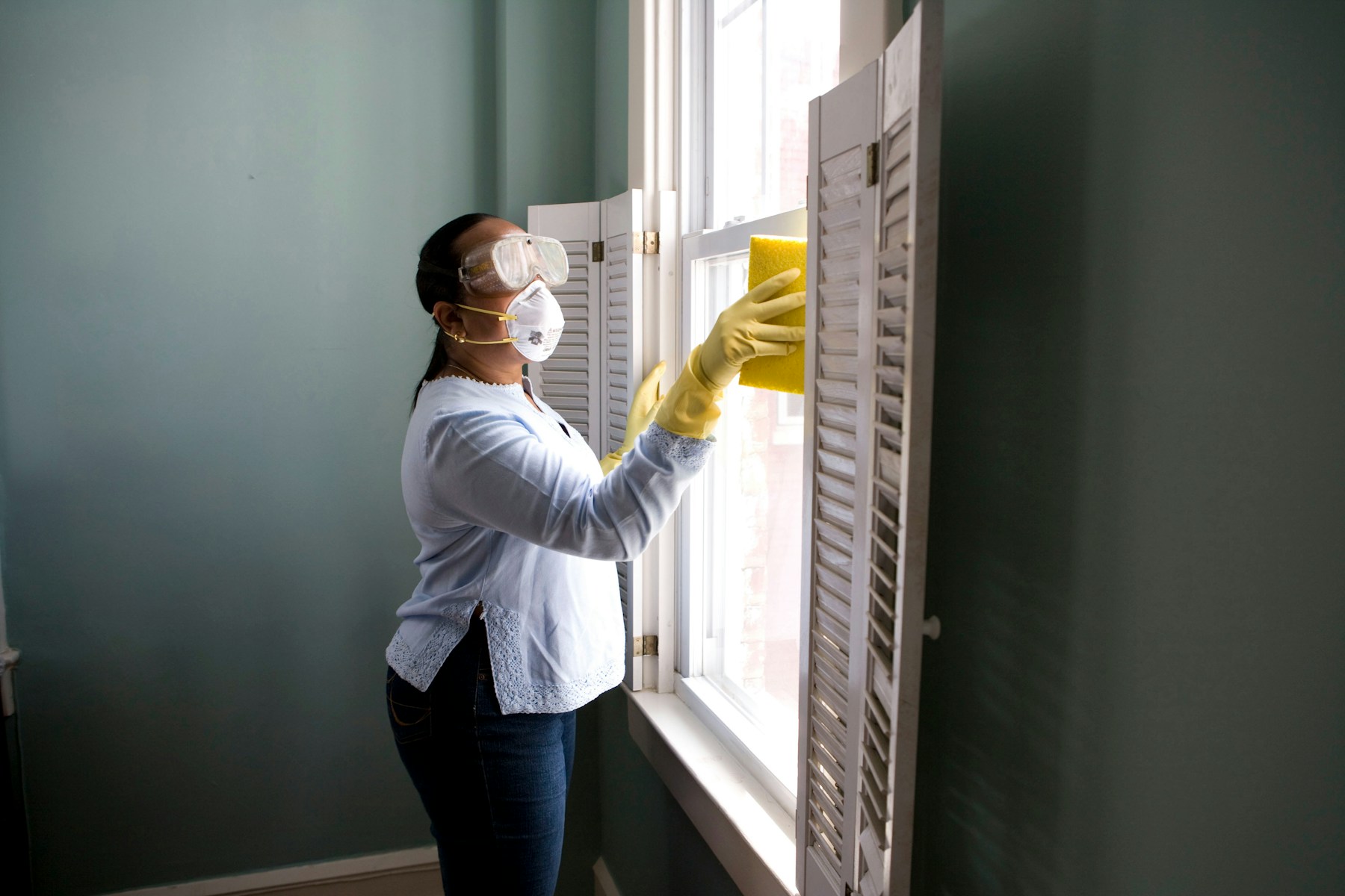 Property maintenance professional preparing an interior for service