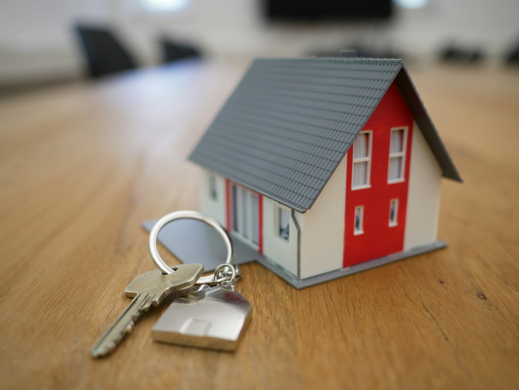 House model and keys for a property consultation